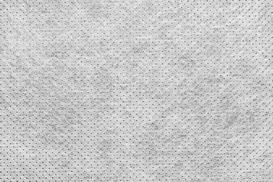 Interlining, synthetic fiber in pastel colors, as a background, texture.