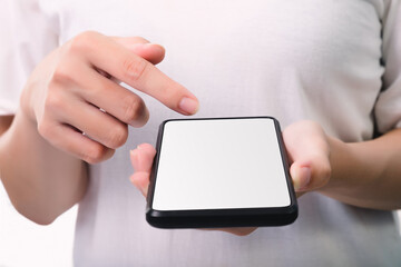 Woman hand holding the black smartphone with blank screen  isolated on white background