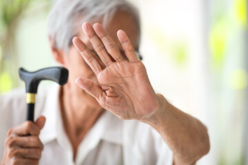 Asian senior woman making stop gesture with palm,against domestic violence,old people raising hand to show sign,stop bullying the elderly,physical harm,psychological damage,abuse,mistreatment concept - obrazy, fototapety, plakaty