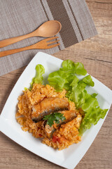 Fried rice with canned fish in a white plate.Thai food