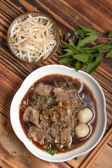 Braised pork noodles with vegetables.and pork balls with soup Thai food