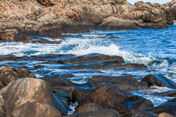 Breaking waves at a rocky coast