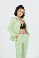 Portrait isolated cutout studio shot of Asian sexy curly hair fashion businesswoman in green suit...