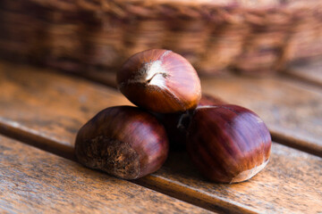 natural chestnuts on the wooden table