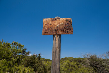 old property delimitation sign corroded by rust,  s'Estalella, s Estanyol de Migjorn, Llucmajor, Majorca, Spain