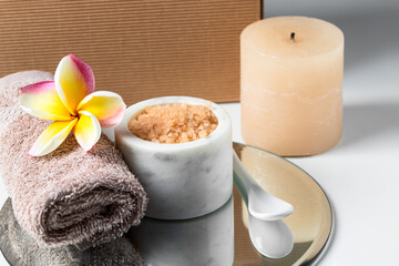 Spa products, towel, salt candle on mirror try for relax and massage
