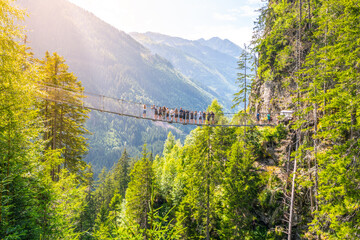 Metal swing bridge over the Riesach waterfall