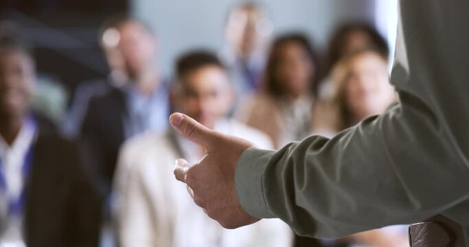 Conference, presentation or workshop with an audience of business people learning new growth strategy. Hands of a speaker talking at a trade show or leadership event giving a speech