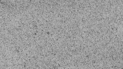 The texture of white stone with black inclusions and dots.