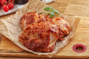 Marinated chicken leg in tomato sauce
