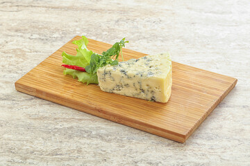 Blue cheese piece over board