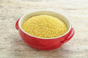 Raw couscous in the bowl
