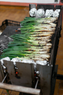 Pile of calcots on grill