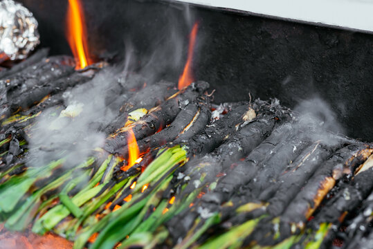 Pile of calcots on grill