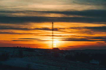 Obraz premium sunset over winter snowed field