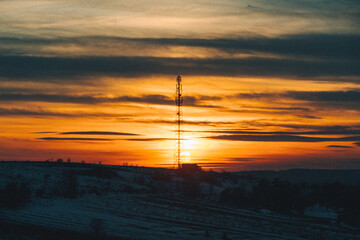 sunset over winter snowed field