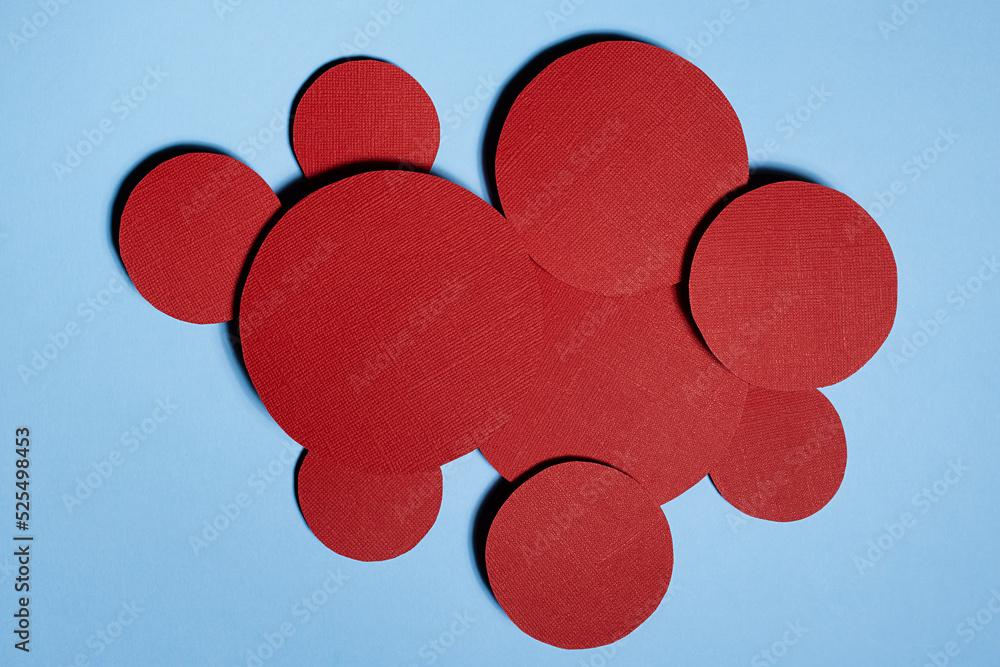 Poster colorful abstract background with red textured circles as decorative swarm, space for text on blue b