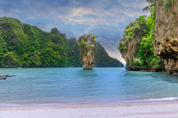 Fototapeta na wymiar Island Phuket Thailand. Lovely rock in the middle of the ocean surrounded by mountains