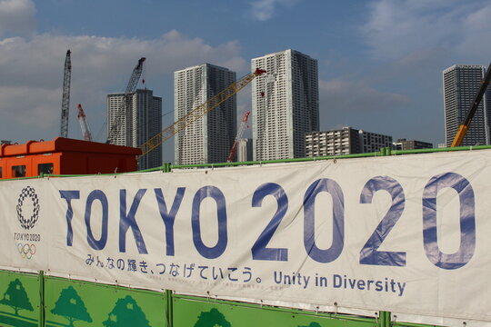 TOKYO, JAPAN - September 30, 2017: A Banner For The Tokyo Olympics And Paralympics Around The Construction Site For The Olympic Village Being Built In The Harumi District Of 2020 Olympics.