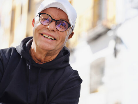 Tranquil Senior Man In Casual Wear In City