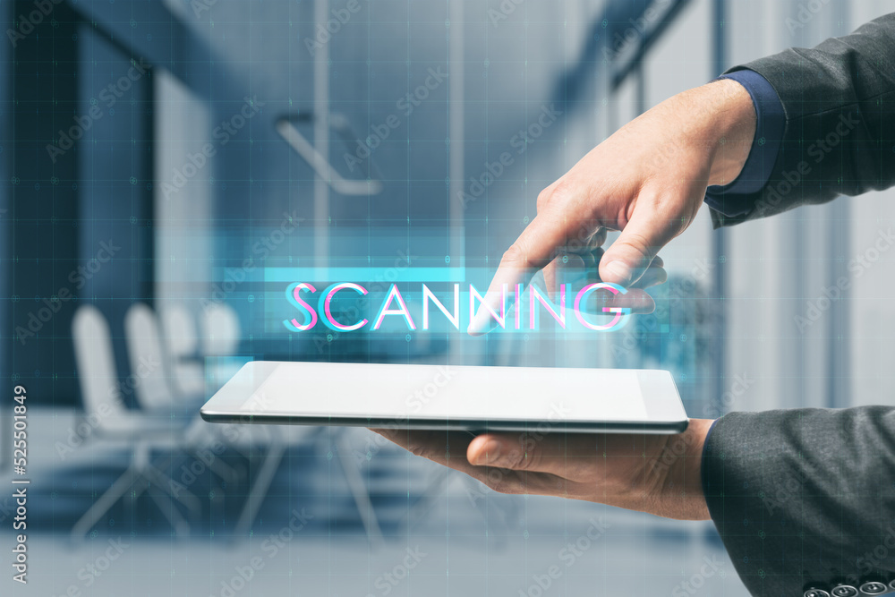 Poster close up of businessperson hand pointing at tablet with creative digital text hologram on blurry off