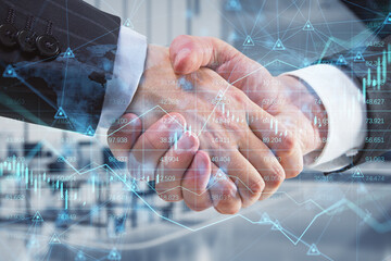 businesspeople shaking hands on abstract glowing forex chart, map and arrows on index hologram, blurry office interior background. Trade, teamwork, financial growth, analytics and market concept.