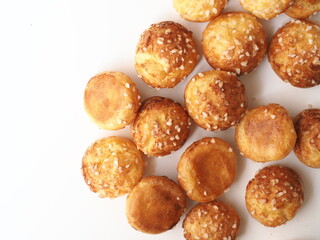top view Chouquettes coated with sugar nibs on white background