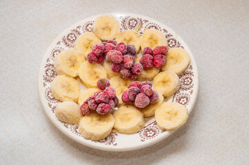frozen bananas and strawberries on a plate