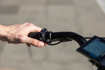 Anonymous crop man riding bike in street
