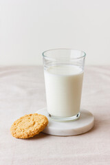 Glass of fresh milk with oatmeal cookie