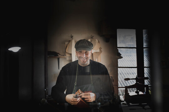 Man polishing leather in atelier