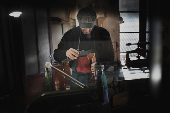 Man polishing leather in atelier