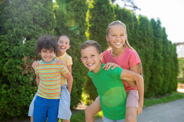 Fototapeta premium Younger friends spending time actively summer holidays