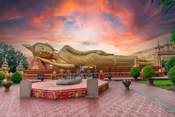 A reclining Buddha statue at Wat Pha That Luang lacated in Vientiane, Laos.