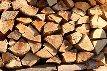 Stack of chopped firewood as background, closeup