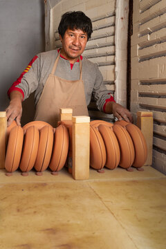 Peruvian man with various ceramic