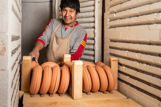 Peruvian man with various ceramic
