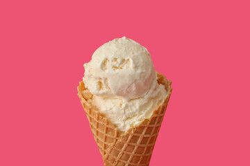 Delicious ice cream in waffle cone on pink background, closeup