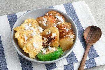 Indonesian sweet snack called gethuk. Made from mashed cassava, and sprinkled with grated coconut, it tastes sweet and delicious. 