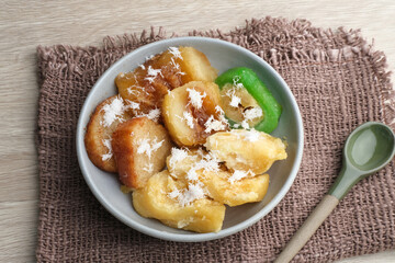 Indonesian sweet snack called gethuk. Made from mashed cassava, and sprinkled with grated coconut, it tastes sweet and delicious. 