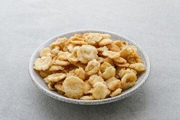 Emping, Emping mlinjo gepuk. Indonesian chips, a bite-size snack kripik cracker, made of melinjo or belinjo (Gnetum gnemon) nuts (which are seeds).
