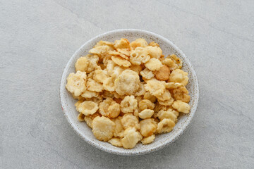 Emping, Emping mlinjo gepuk. Indonesian chips, a bite-size snack kripik cracker, made of melinjo or belinjo (Gnetum gnemon) nuts (which are seeds).
