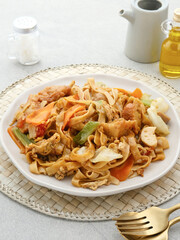 Kwetiaw or Kwetiau is Chinese food which is popular in Indonesia, cooked by frying added with chicken, seafood and complementary vegetables. 