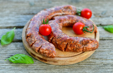 Raw  Pork Sausages with spices  on wooden cutting board