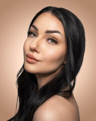 Fototapeta premium Portrait of a beautiful woman wearing makeup showing eyelashes