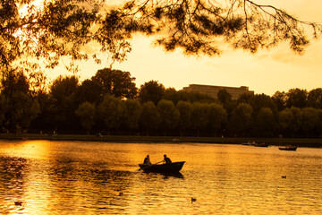 Moscow, Russia - August 16, 2022: People go boating on a pond on a hot summer day in Izmaylovsky Park