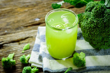 Glass of broccoli juice, broccoli Healthy drink on wood back ground, Green vegetable smoothie
