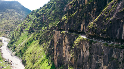 dangerous curvy road with steep cliffs and river in Himachal Pradesh India at Tranda Dhank