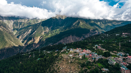 Kalpa Village with Himalayan Mountain peaks at sunset in Himachal Pradesh India, aerial