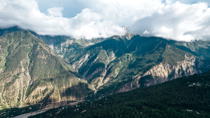 Fototapeta na wymiar aerial mountain range landscape over Kalpa in Himachal Pradesh on sunny summer day in India
